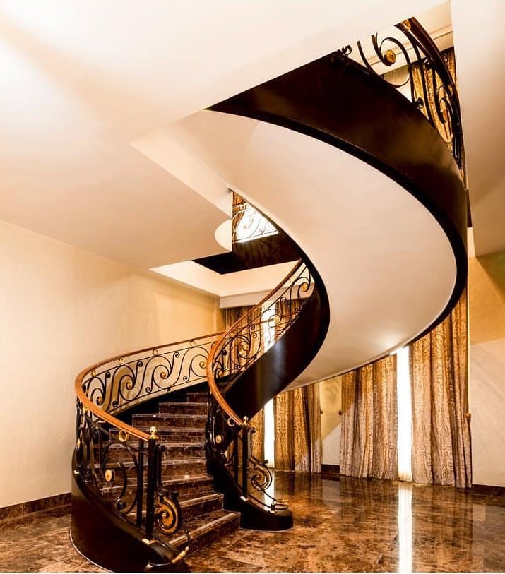 indoor curved stairs in a home in san jose