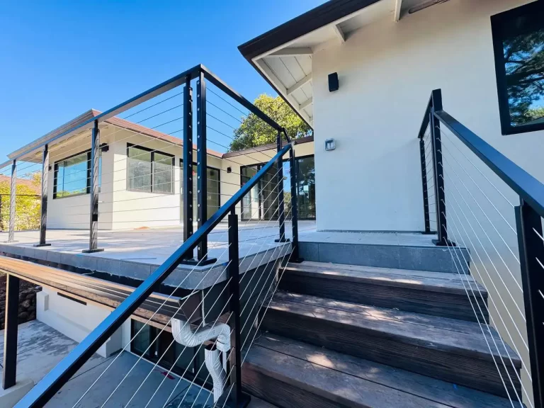 Stylish black cable railing on a residential deck designed by Usairs, providing unobstructed views for homes in the Bay Area.