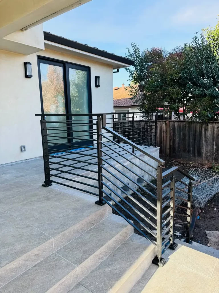 Black metal railings on a balcony, offering a modern and secure outdoor solution.